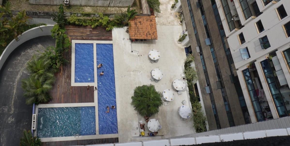 Apto Aconchegante: Beachfront Comfort with BBQ & Daily Cleaning Guaruja Exterior photo